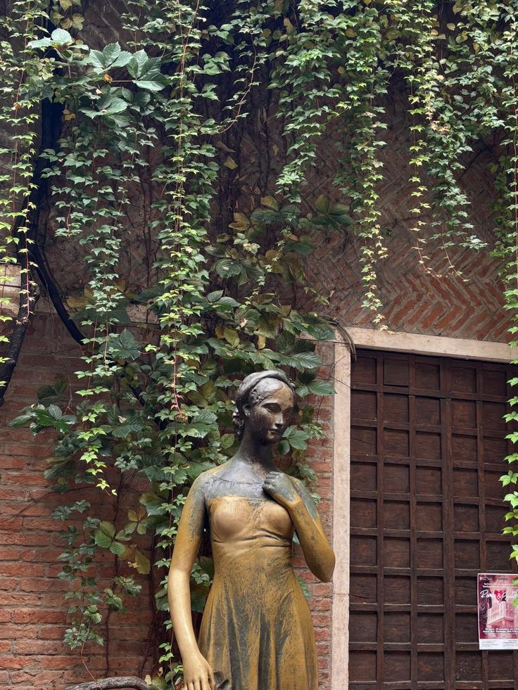 The medieval streets of Verona with the Torre dei Lamberti rising above the red-tiled roofs.